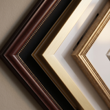 Close-up of the mahogany beaded, flat gold and beaded antique gold mouldings with bevelled white mats 