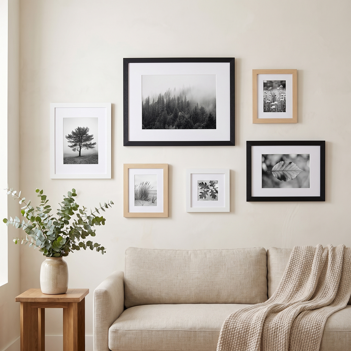 The six-frame set arranged above a linen sofa in a living room 