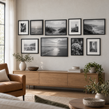 Mixed-Size Sofa Gallery — Black · 9 Frames — styled in a bright living room