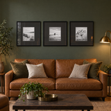 Wide Mat Trio 16x16 Black Mat — Black · 3 Frames — styled in a warm evening room