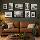 Anchored Sofa Gallery — Black · 9 Frames — styled in a warm evening room