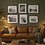 Stair-Step Sofa Gallery — Black · 6 Frames — styled in a warm evening room