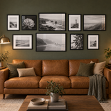 Mixed-Size Sofa Gallery — Black · 9 Frames — styled in a warm evening room