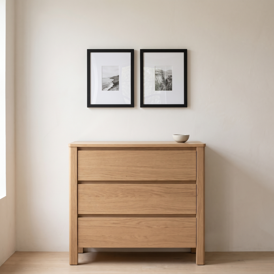 Black Wide Mat Pair: two black Signature 11x14 frames with wide 5x7 mats, side by side. Shown in a bedroom, above a small light-oak chest of drawers 