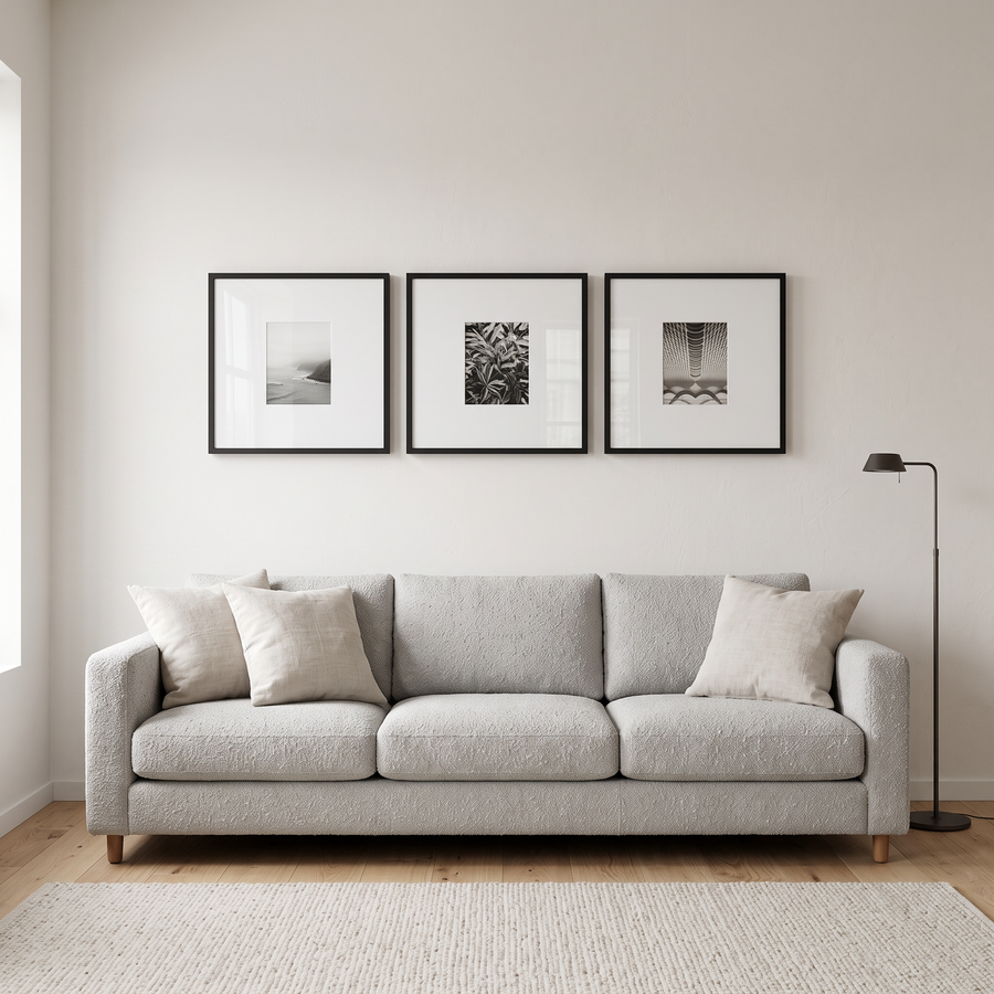 Wide Mat Trio 20x20 (8x10 Mat): three black Streamline 20x20 frames, each matted to 8x10, in one row. Shown in a bright living room, above a light grey boucle sofa 