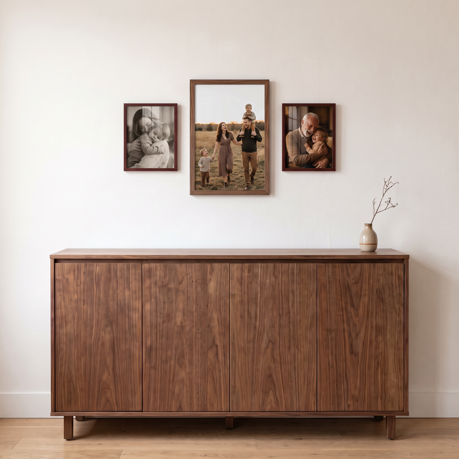 Warm Wood Trio: a walnut 12x18 between two mahogany 8.5x11 frames, in one row; all unmatted. Shown in an entryway, above a walnut sideboard, with family photos in the frames 