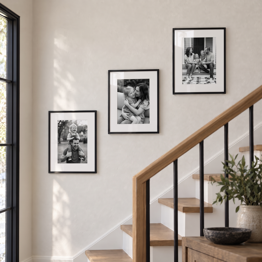Minimal Stairway Trio (11x14) — Black · 3 Frames — styled on the wall, with family photos in the frames