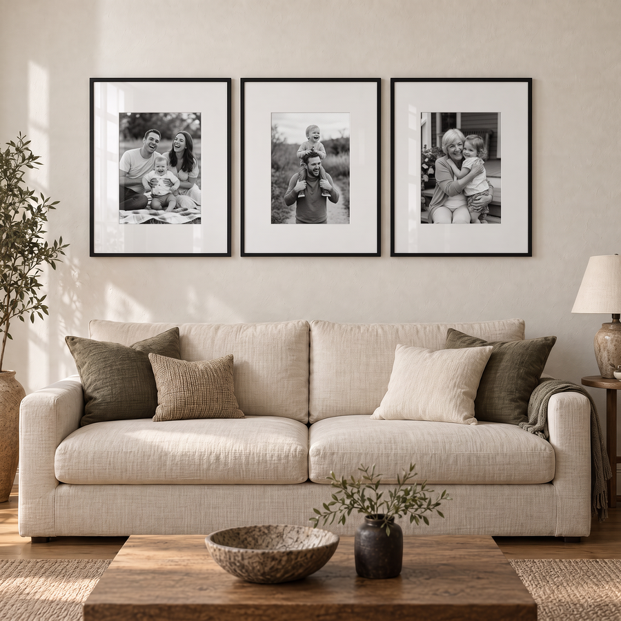 Wide Mat Trio 24x30 — Black · 3 Frames — styled on the wall, with family photos in the frames