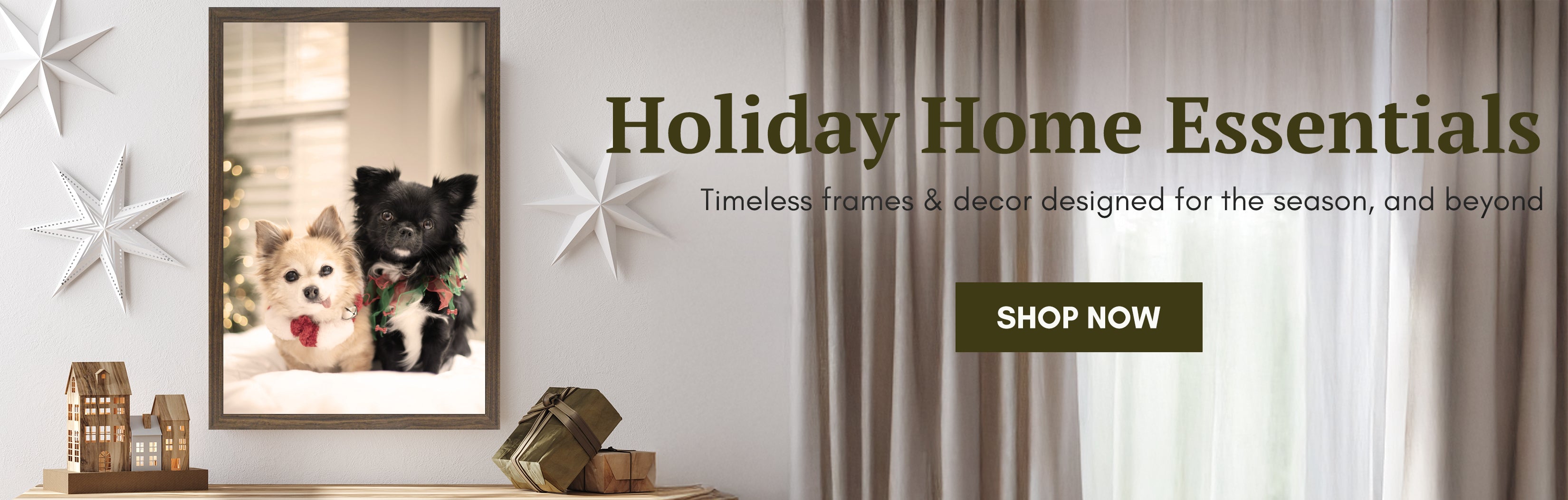 Holiday home essentials with a framed photo of two dogs and decorative items.