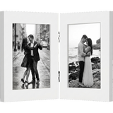 Hinged white frame with two panels, a couple dancing in the rain and a couple on rocks 