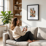 lifestyle woman uploading photos to digital frame