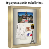 Card reading display memorabilia and collections, a gold shadow box of travel keepsakes 