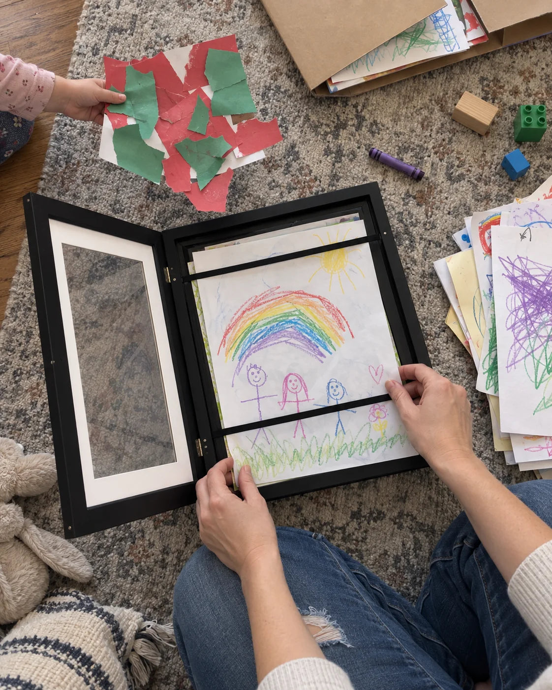A family sorting artwork together on the weekend